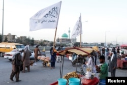 Taliban flags are seen on a street in Kabul, Afghanistan, Sept. 16, 2021