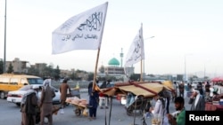 Taliban flags are seen on a street in Kabul, Afghanistan, Sept. 16, 2021