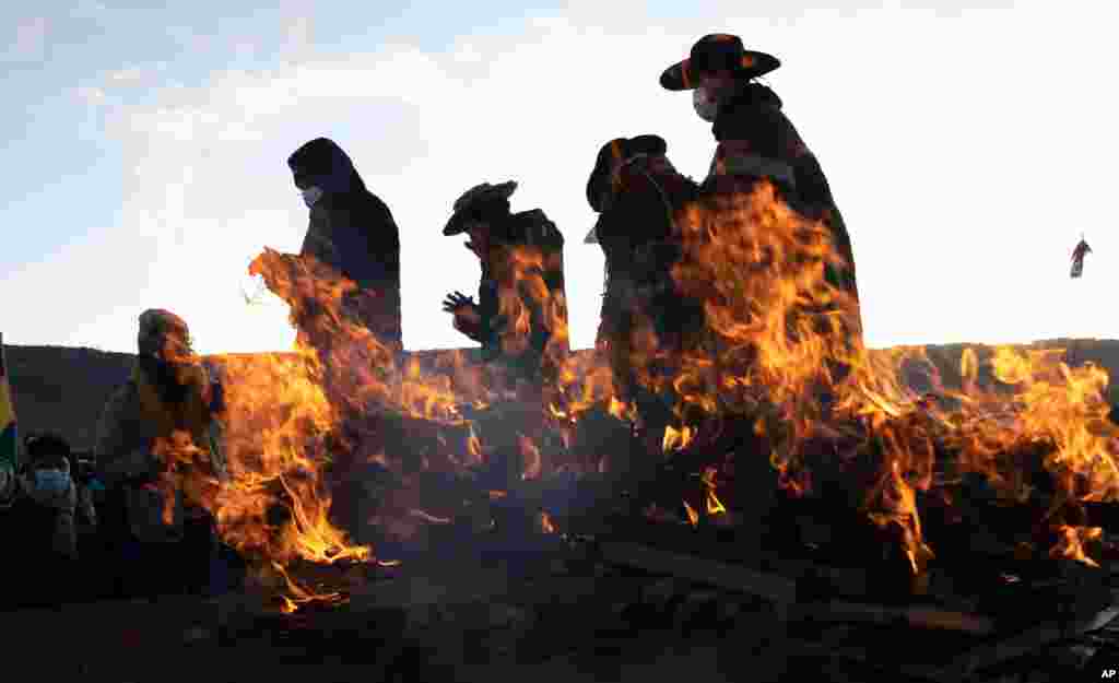 Aymara Indigenous religious leaders finish a New Year&#39;s ritual at the ancient city of Tiwanaku, Bolivia.&#160;The Aymara are celebrating the Andean New Year of 5,529 as well as the Southern Hemisphere&#39;s winter solstice.