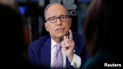 FILE - Economic analyst Larry Kudlow appears on CNBC at the New York Stock Exchange, (NYSE) in New York, March 7, 2018.