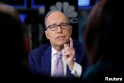 FILE - Economic analyst Larry Kudlow appears on CNBC at the New York Stock Exchange, (NYSE) in New York, March 7, 2018.