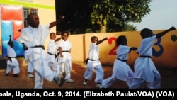 Children learn to kick and punch in Kung Fu classes, Kampala, Uganda, Oct. 9, 2014. 