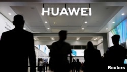 The Huawei logo is pictured at the IFA consumer tech fair in Berlin, Germany, September 6, 2019. REUTERS/Hannibal Hanschke/File Photo