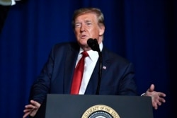 FILE - President Donald Trump addresses the audience at the 75th annual AMVETS National Convention in Louisville, Ky., Aug.21, 2019.