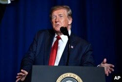 FILE - President Donald Trump addresses the audience at the 75th annual AMVETS National Convention in Louisville, Ky., Aug.21, 2019.