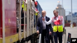 President Joe Biden and Chief Operating Officer of Lobito Atlantic Railway Nicolas Gregoire tour the Lobito Port Terminal in Lobito, Angola, Dec. 4, 2024. 