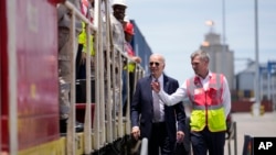 U.S. President Joe Biden and Chief Operating Officer of Lobito Atlantic Railway Nicolas Gregoire tour the Lobito Port Terminal in Lobito, Angola, Dec. 4, 2024. 