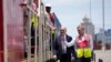 President Joe Biden and Chief Operating Officer of Lobito Atlantic Railway Nicolas Gregoire tour the Lobito Port Terminal in Lobito, Angola, Dec. 4, 2024. 