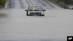 A car   is near  stranded connected  a flooded roadworthy  during a tempest  Nov. 21, 2024, successful  Windsor, Calif.