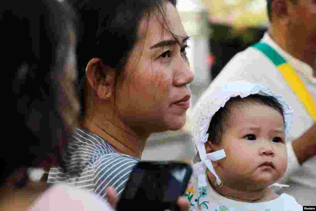 Pan Ei Mon, wife of jailed Reuters journalist Wa Lone, is seen with their daughter after attending a hearing at Myanmar's Supreme Court in Naypyitaw, Myanmar.