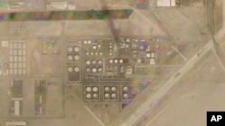 تصویری ماهواره‌ای از شرکت ملی نفت ابوظبی که دود بر فراز آن دیده می‌شود. ۲۷ دی ۱۴۰۰