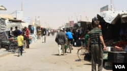 FILE - Refugee camps in Jordan, Turkey and Lebanon have grown into villages and towns. But residents say without many resources or rights, there is no future in the camps. Zaatari Camp, Jordan. (H. Murdock/VOA)