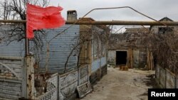 Houses are left heavily damaged in the village of Shyrokyne, Donetsk region, Russian-controlled Ukraine, Feb. 16, 2024.
