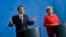 German Chancellor Angela Merkel, right, and Chinese Premier Li Keqiang brief the media during a meeting at the chancellery in Berlin, July 9, 2018. 