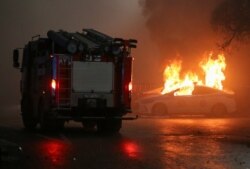 A police car burns during a protest in Almaty, Kazakhstan, Jan. 5, 2022.