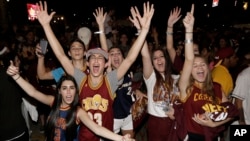 Cleveland Cavaliers fans celebrate after the Cavaliers defeated the Golden State Warriors 93-89 in Game 7 of the NBA basketball Finals, Sunday, June 19, 2016, in Cleveland.