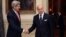 French Foreign Affairs Minister Laurent Fabius (R) welcomes U.S. Secretary of State John Kerry at the Foreign Affairs ministry in Paris, October 22, 2013.