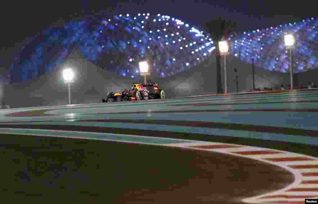 Red Bull Formula One driver Sebastian Vettel of Germany races during the Abu Dhabi F1 Grand Prix at the Yas Marina circuit on Yas Island, United Arab Emirates. Red Bull's four-times world champion Vettel won the Abu Dhabi Grand Prix to chalk up his seventh successive victory.