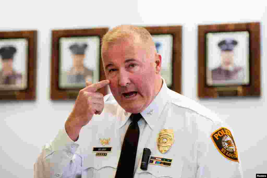 St. Louis County Police Chief Jon Belmar indicates where one of the police officers was shot during protests early Thursday, during a press conference in Clayton, Mo.