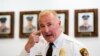 St. Louis County Police Chief Jon Belmar indicates where one of the police officers was shot during protests early Thursday, during a press conference in Clayton, Mo.