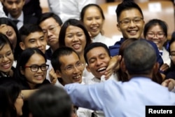 U.S. President Barack Obama greets members of the audience during a town hall meeting with members of the Young Southeast Asian Leaders Initiative (YSEALI) at the GEM Center in Ho Chi Minh City, May 25, 2016.