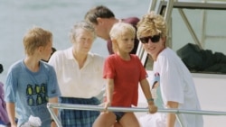 FILE - A photo of Princess Diana and sons Harry and William at Banana Bay Beach, St. Kitts, Jan. 4, 1993.