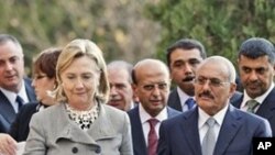 Yemeni President Ali Abdullah Saleh, right, walks with U.S. Secretary of State Hillary Rodham Clinton, as she arrives at the Presidential Palace in Sanaa, Yemen, Tuesday, Jan. 11, 2011.