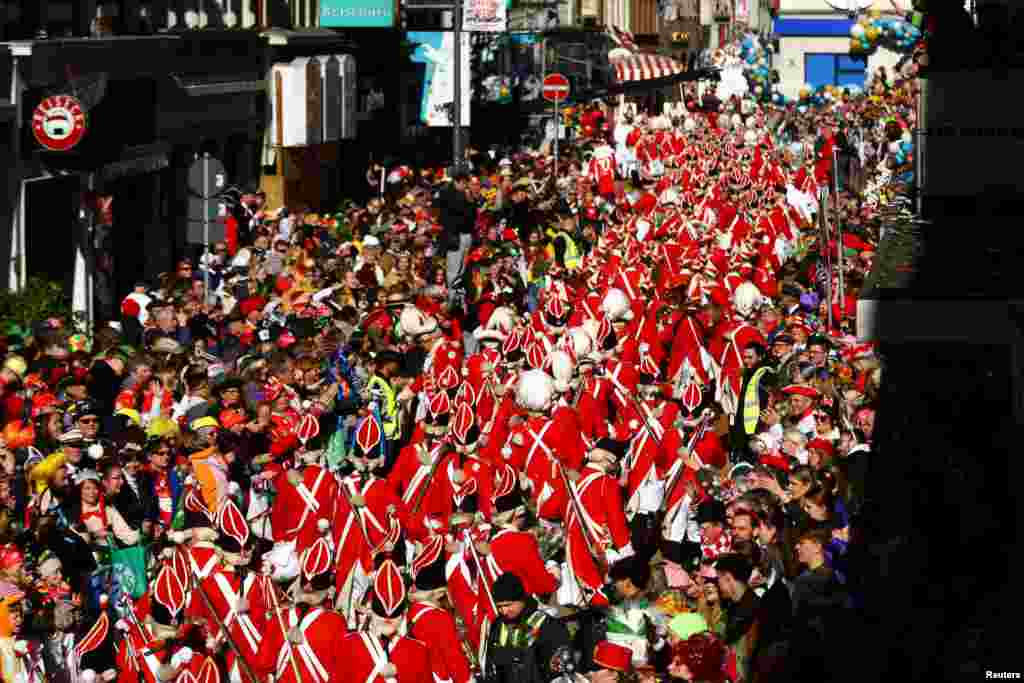 Revelers take part in the traditional &quot;Rosenmontag&quot; Rose Monday carnival parade in Cologne, Germany.