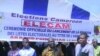 FILE - Cameroon elections management body, ELECAM officials encourage the population to register in Bafoussam, Jan. 5 2018. 