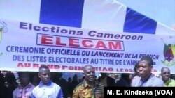 FILE - Cameroon elections management body, ELECAM officials encourage the population to register in Bafoussam, Jan. 5 2018. 