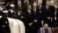 President Barack Obama, Vice President Joe Biden, former President Bill Clinton, and Senate Majority Leader Harry Reid of Nevada stand as the casket is brought in at the funeral service for the late Sen. Daniel Inouye, D-Hawaii, at the Washington National