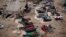 FILE - Ethiopian migrants sleep out in the open near a transit center where they wait to be repatriated, in the western Yemeni town of Haradh, on the border with Saudi Arabia. The U.N. refugee agency reports nearly 106,000 people, mostly from Ethiopia and Somalia, have risked their lives on the high seas to reach Yemen in 2016.