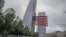 FILE - An American flag is placed along the South Pool prior to a ceremony at the World Trade Center site in New York, Sept. 11, 2015.