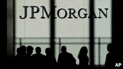 FILE - The JPMorgan Chase & Co. logo is displayed at their headquarters in New York, Oct. 21, 2013. 