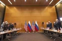 US Deputy Secretary of State Wendy Sherman, left, and Russian deputy Foreign Minister Sergei Ryabkov, right, attend security talks at the United States Mission at the United States Mission in Geneva, Switzerland, Jan. 10, 2022. (AP)