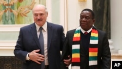  Belarus' President Alexander Lukashenko, left, and Zimbabwe's President Emmerson Mnangagwa prior to their meeting in Minsk, Belarus, Thursday, Jan. 17, 2019. (Natalia Fedosenko/TASS News Agency Pool Photo via AP)