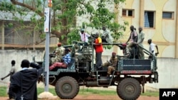 FILE - A truck with former Seleka coalition rebels drives through Bangui, Central African Republic, Oct. 7, 2013.