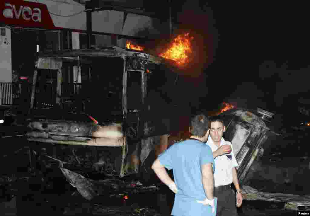 Officials work at the scene of an explosion in the southeastern Turkish town of Gaziantep, August 20, 2012.