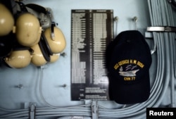 A crew member's hat hangs inside Primary Flight Control of the USS George H.W. Bush aircraft carrier anchored off Stokes Bay in the Solent, Britain, July 27, 2017.