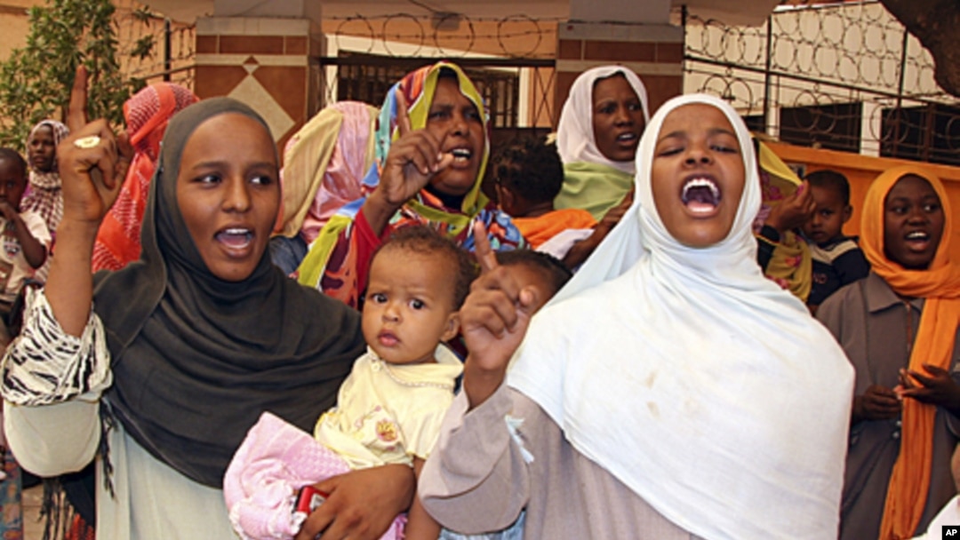People shout during a an Islamic Liberation Party rally to support the Sudanese Armed Forces and condemn the intervention of international peacekeepers in Abyei in Khartoum on June 11, 2011.