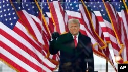 President Donald Trump arrives to speak at a rally, Jan. 6, 2021, in Washington.