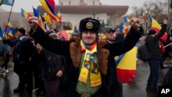 A man clenches his fists during a protest in Bucharest, Romania, March 1, 2025.