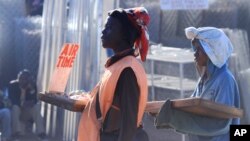 FILE - Vendors sells sweets and mobile phone recharge cards in central Harare.