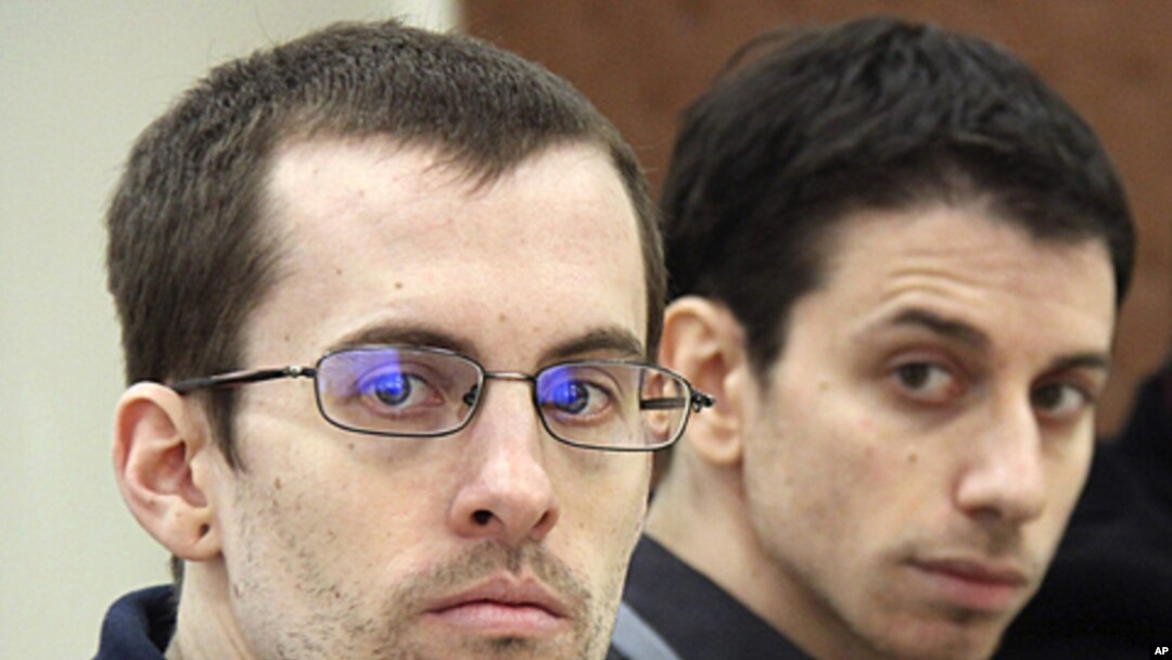 A picture released by Iran's state-run Press TV shows US hikers Shane Bauer (L) and Josh Fattal (R), detained in Iran on spying charges, during the first session of their trial, February 6, 2011 (file photo)