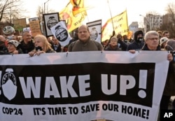 Climate activists attend the March for Climate in a protest against global warming in Katowice, Poland, Dec. 8, 2018, as the COP24 UN Climate Change Conference takes place in the city.