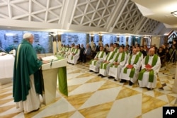 FILE - Pope Francis celebrates a Mass at the Vatican's Santa Marta hotel, Sept.1, 2015.