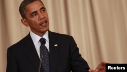 US President Barack Obama speaks during a joint media conference with Thai Prime Minister Yingluck Shinawatra at Government House in Bangkok, November 18, 2012.