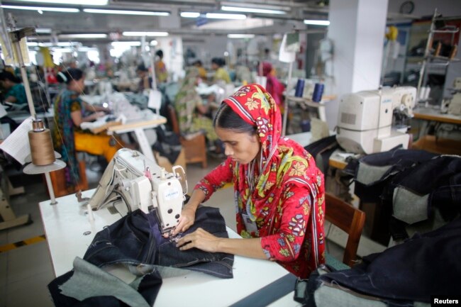 FILE - A worker is seen in a garment factory in Savar, Bangladesh, June 10, 2014.