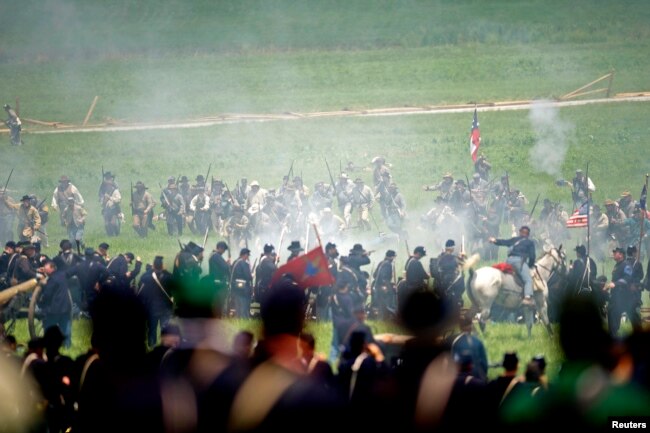 Actors reenact Pickett's Charge during the 150th anniversary of the Battle of Gettysburg.