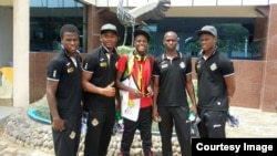 Alvin Zhakata and Zimbabwe soccer players in Rwanda